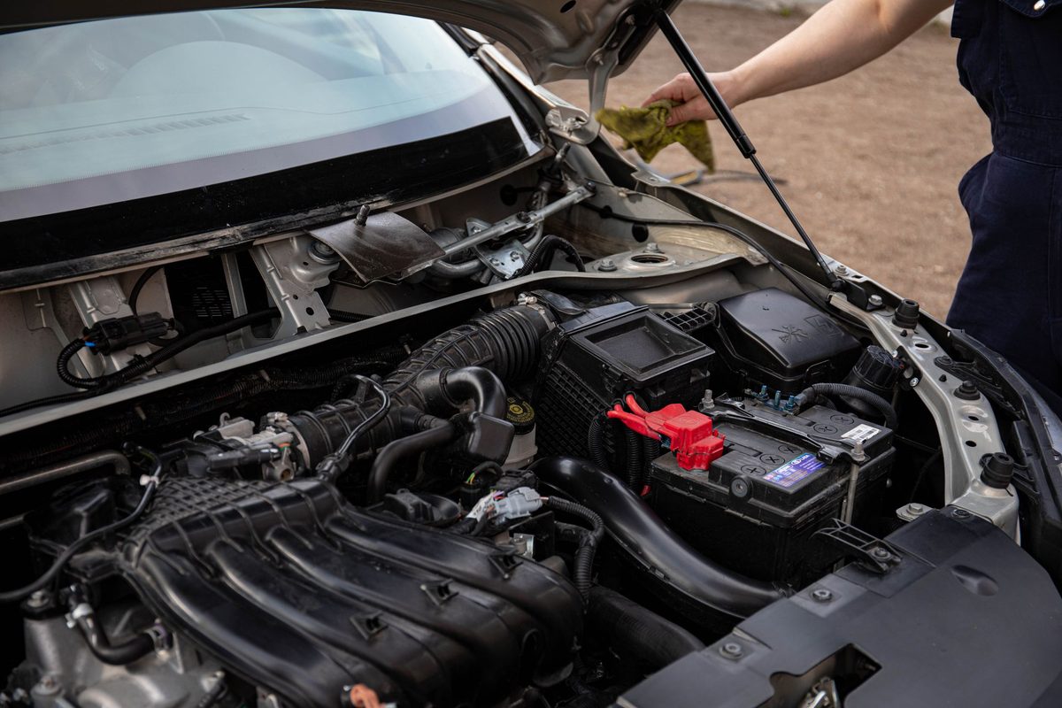 Mechanic inspecting engine bay during full mechanical repair service in Dubai at Shabab Al Lisaili Auto Electric Repair
